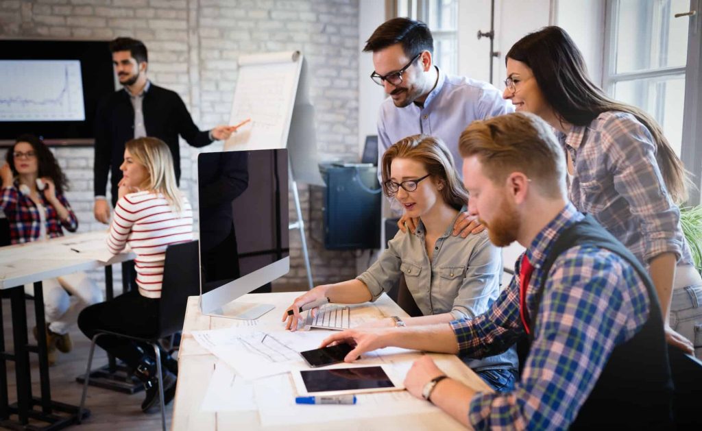 A team working together in a busy office